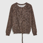 A brown polka dot sweater