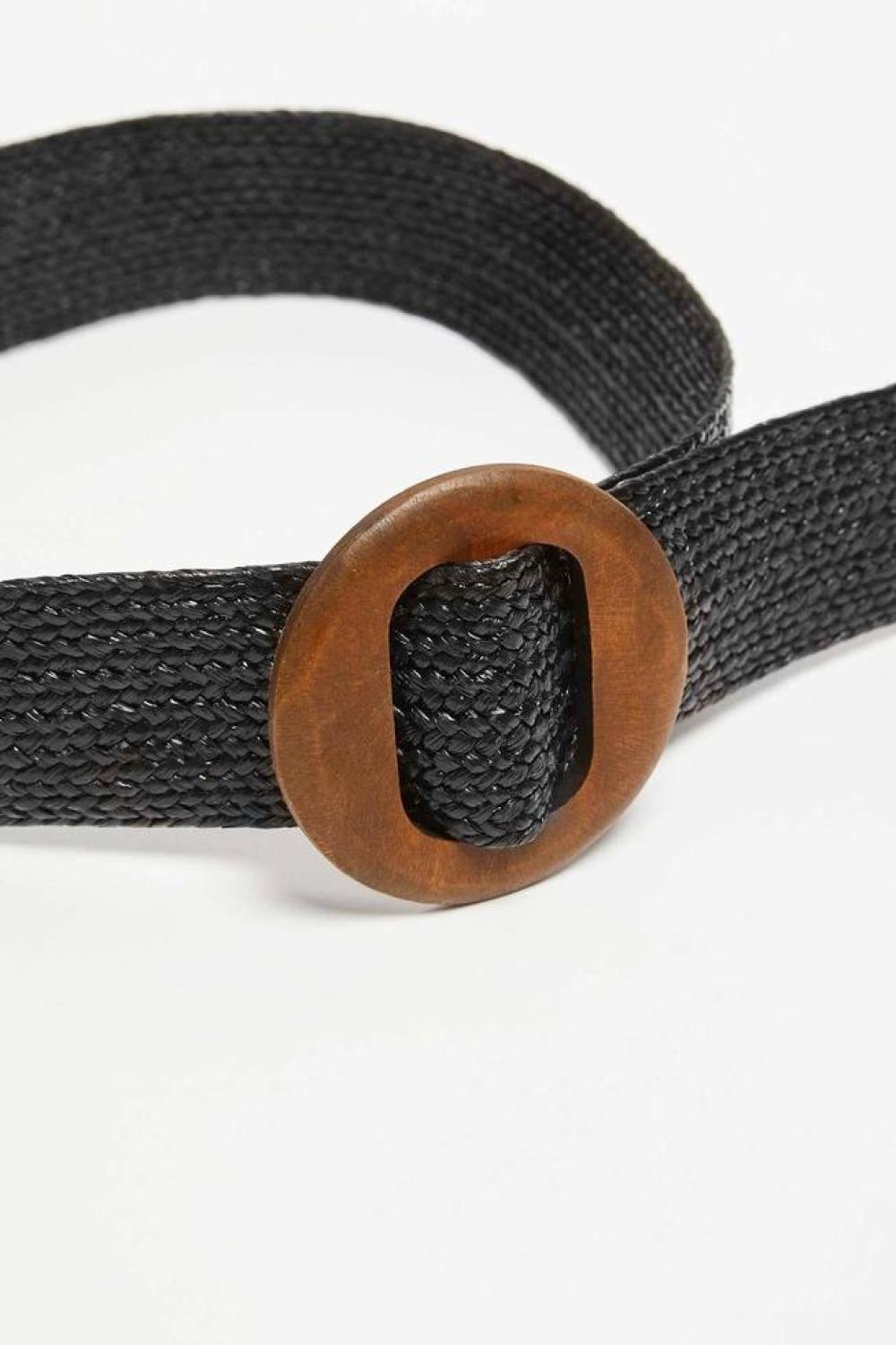 A wide belt in a woven herringbone pattern