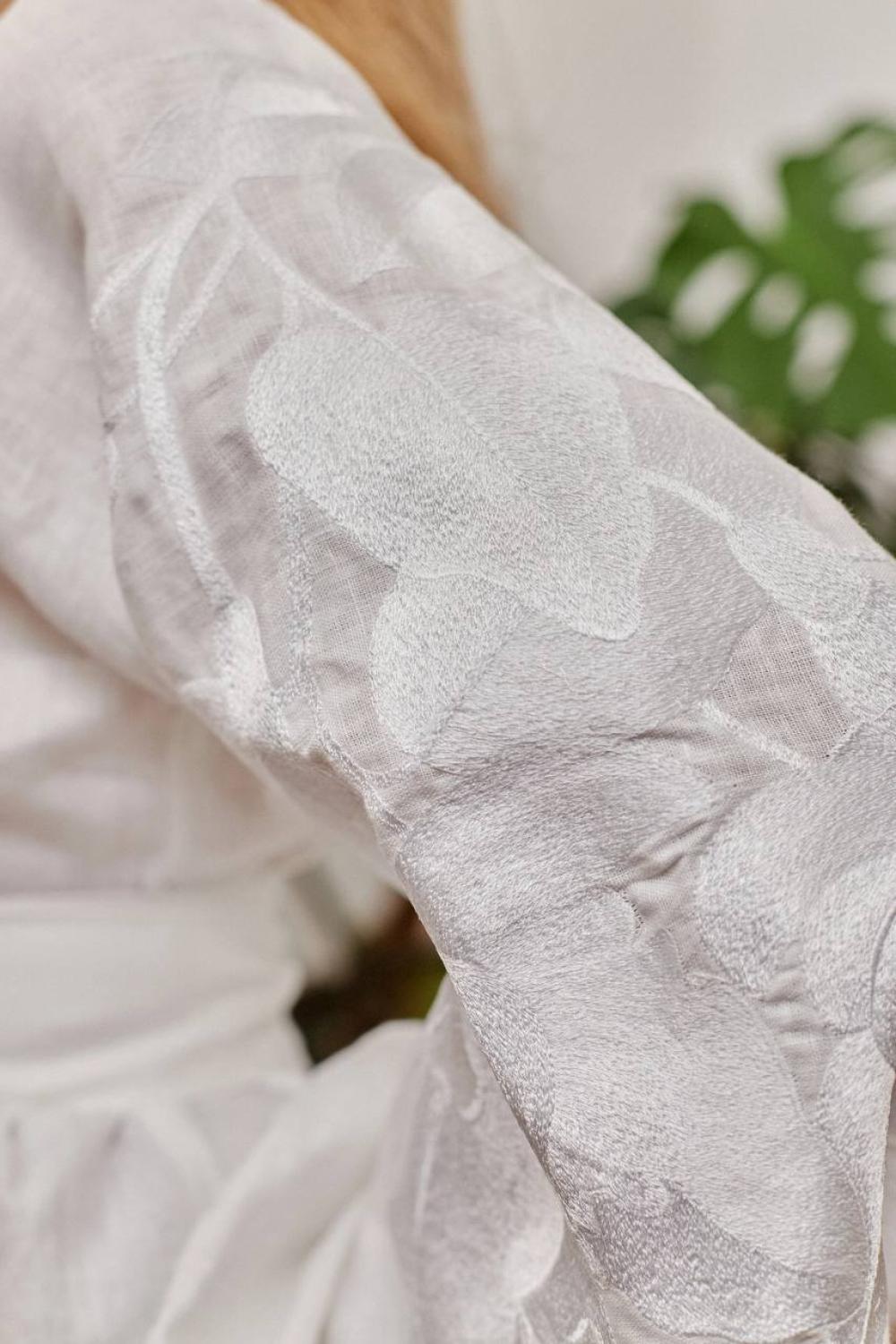 Women's embroidered white on white author's work
