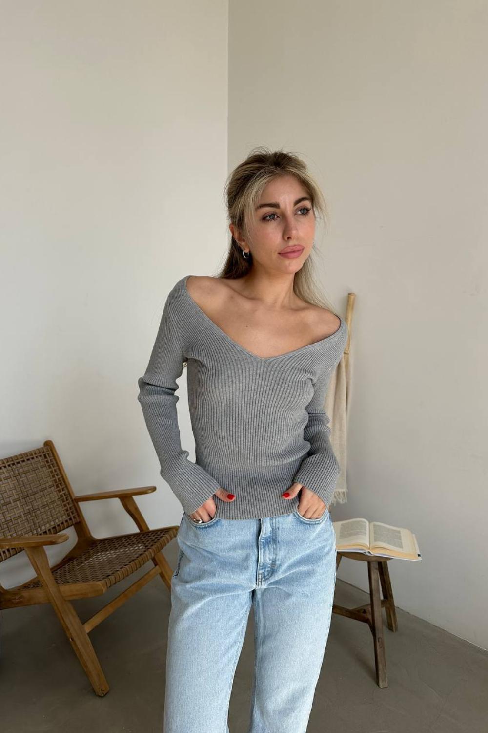Gray jumper with a figured neckline