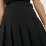 Black pleated mini skirt