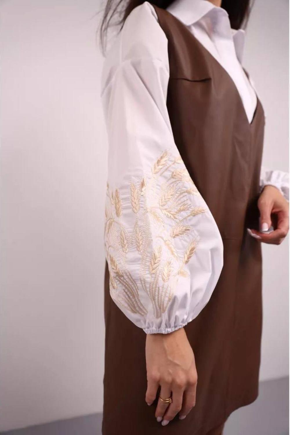 A classic white blouse with embroidered ears of corn