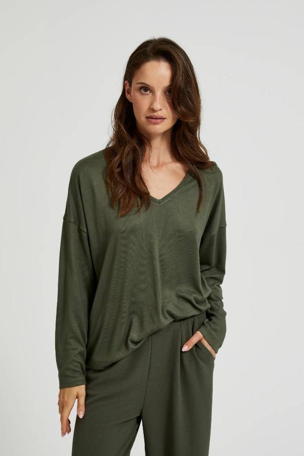 A olive sweater