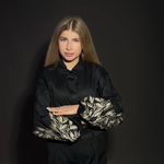 A classic black blouse with embroidered ears of corn