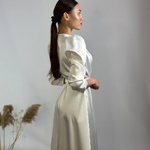 The dress is white satin with a smell of 833