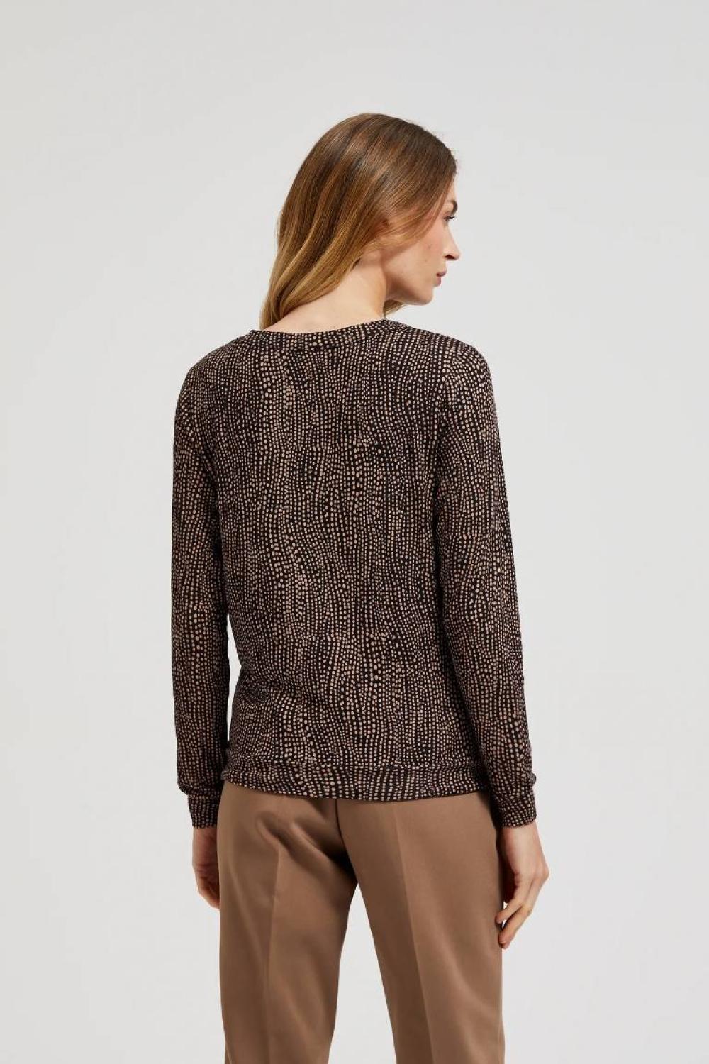 A brown polka dot sweater