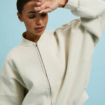 Cream-colored sweater with a zipper