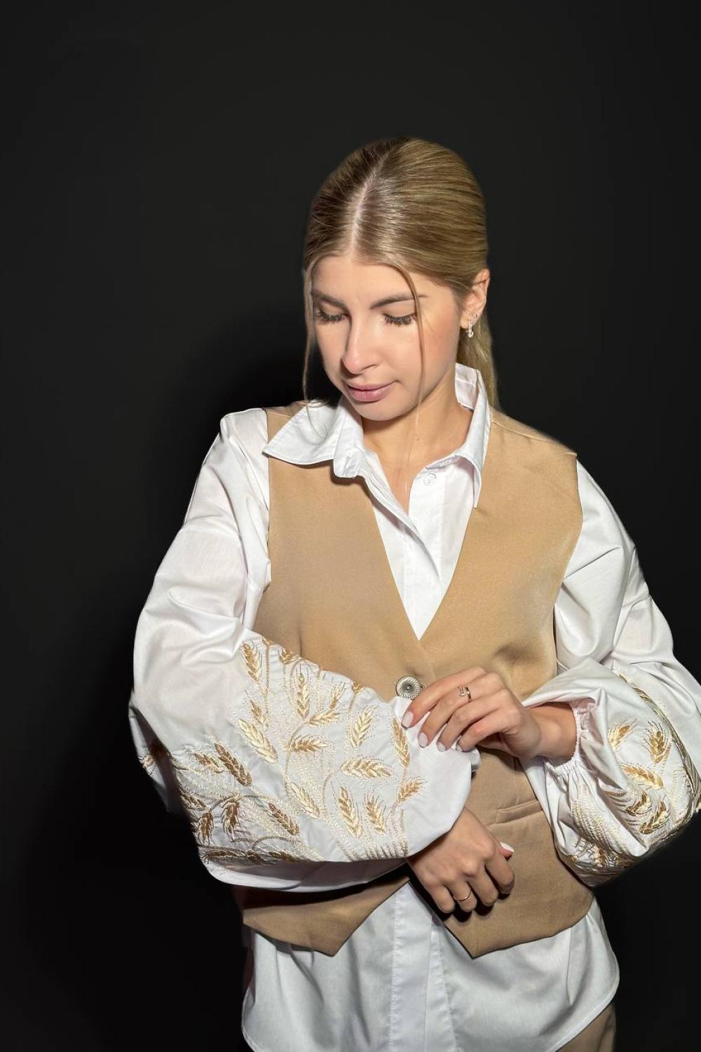 A classic white blouse with embroidered ears of corn