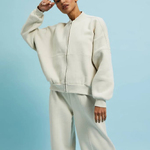 Cream-colored sweater with a zipper