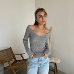 Gray jumper with a figured neckline