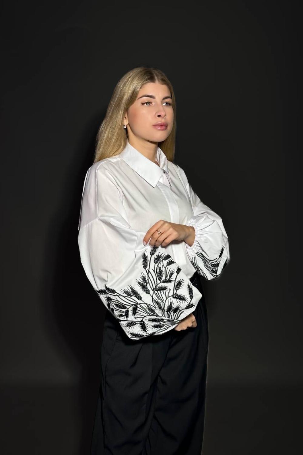 A classic white blouse with embroidered ears of corn