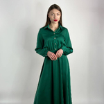 Festive green dress in the style of a shirt.