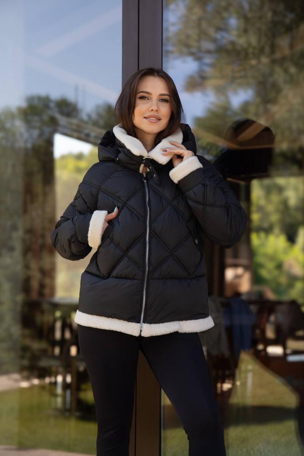 Jacket in black color with artificial fur