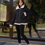 Jacket in black color with artificial fur