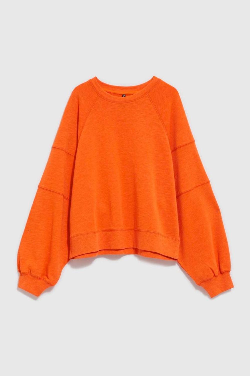 women's sweatshirt is presented in a bright orange color