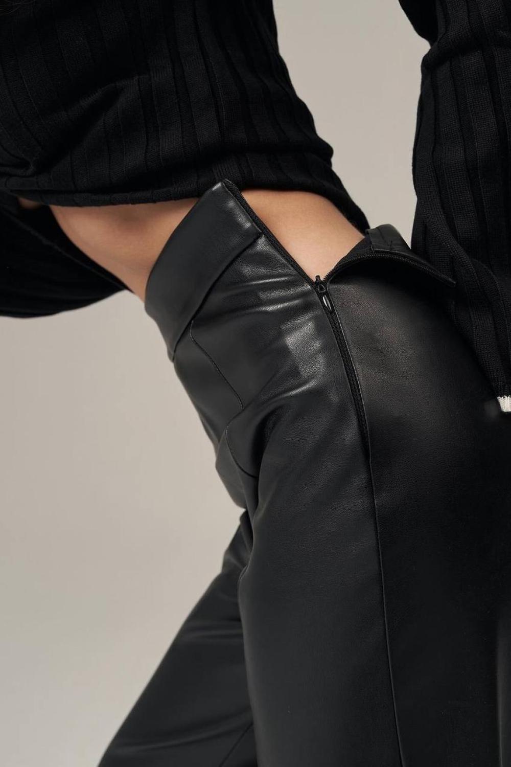 Black straight trousers made of eco-leather with a suede base