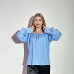Блакитна вишиванка з білою вишивкою