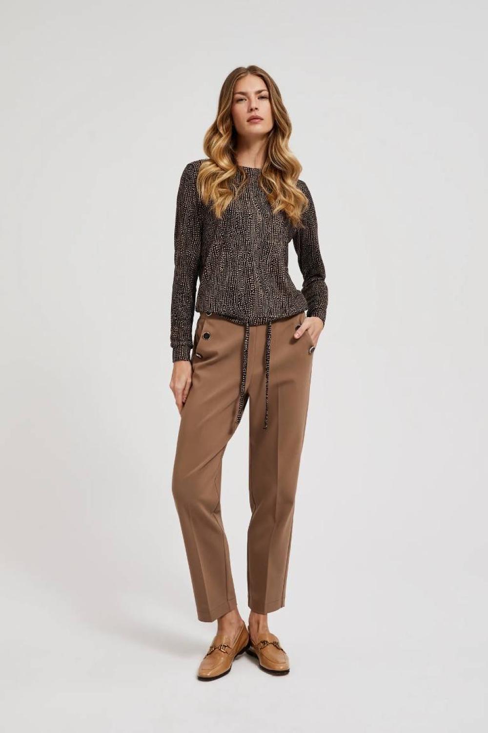A brown polka dot sweater