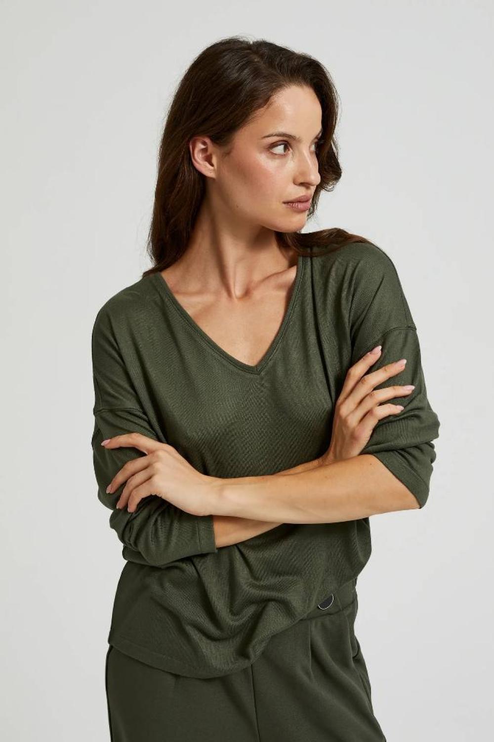 A olive sweater
