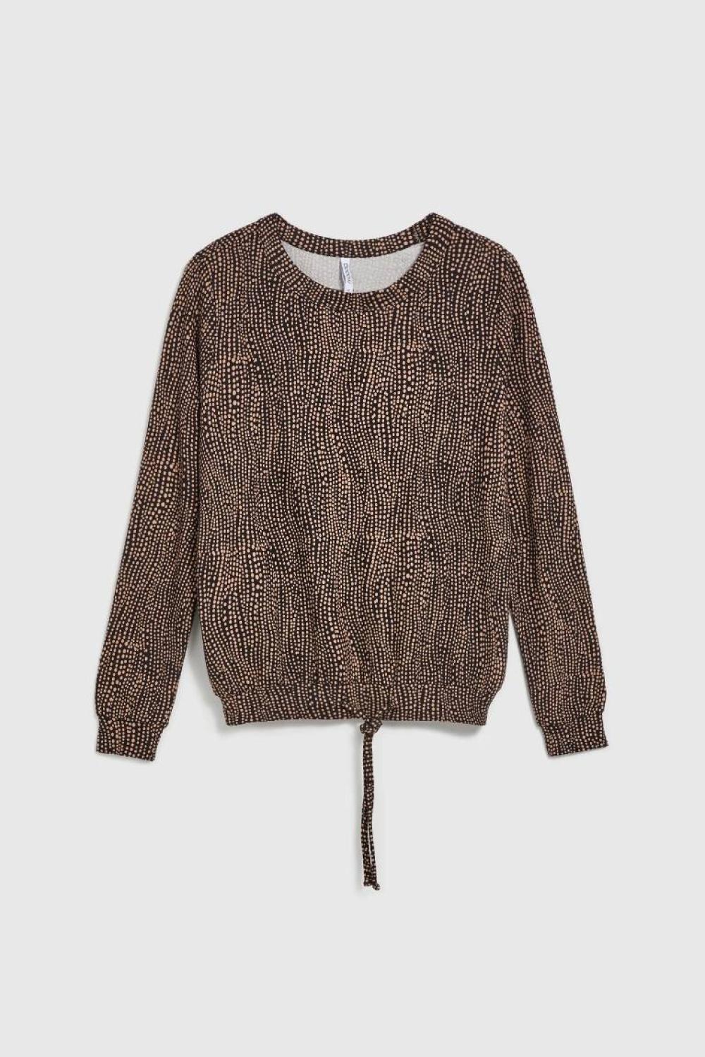 A brown polka dot sweater