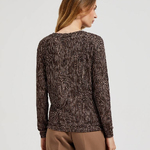 A brown polka dot sweater