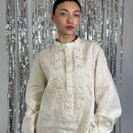 Men's embroidered shirt in a traditional style in a milky ceremonial color