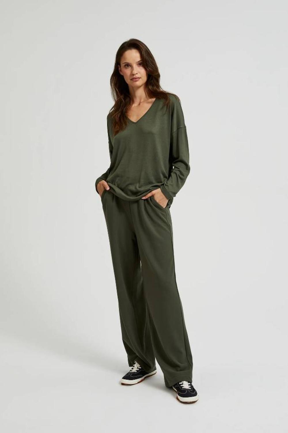A olive sweater