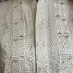 Men's embroidered shirt in a traditional style in a milky ceremonial color