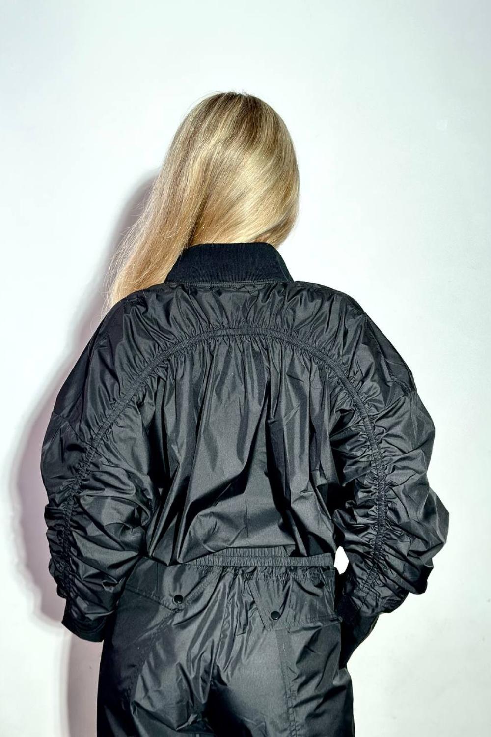 Black suit made of raincoat fabric