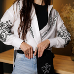 An embroidered accessory pocket