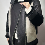 Black and beige eco-fur jacket