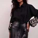 A classic black blouse with embroidered ears of corn