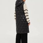 Long quilted vest with hood