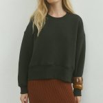 Grey women's sweatshirt on a bike