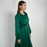 Festive green dress in the style of a shirt.