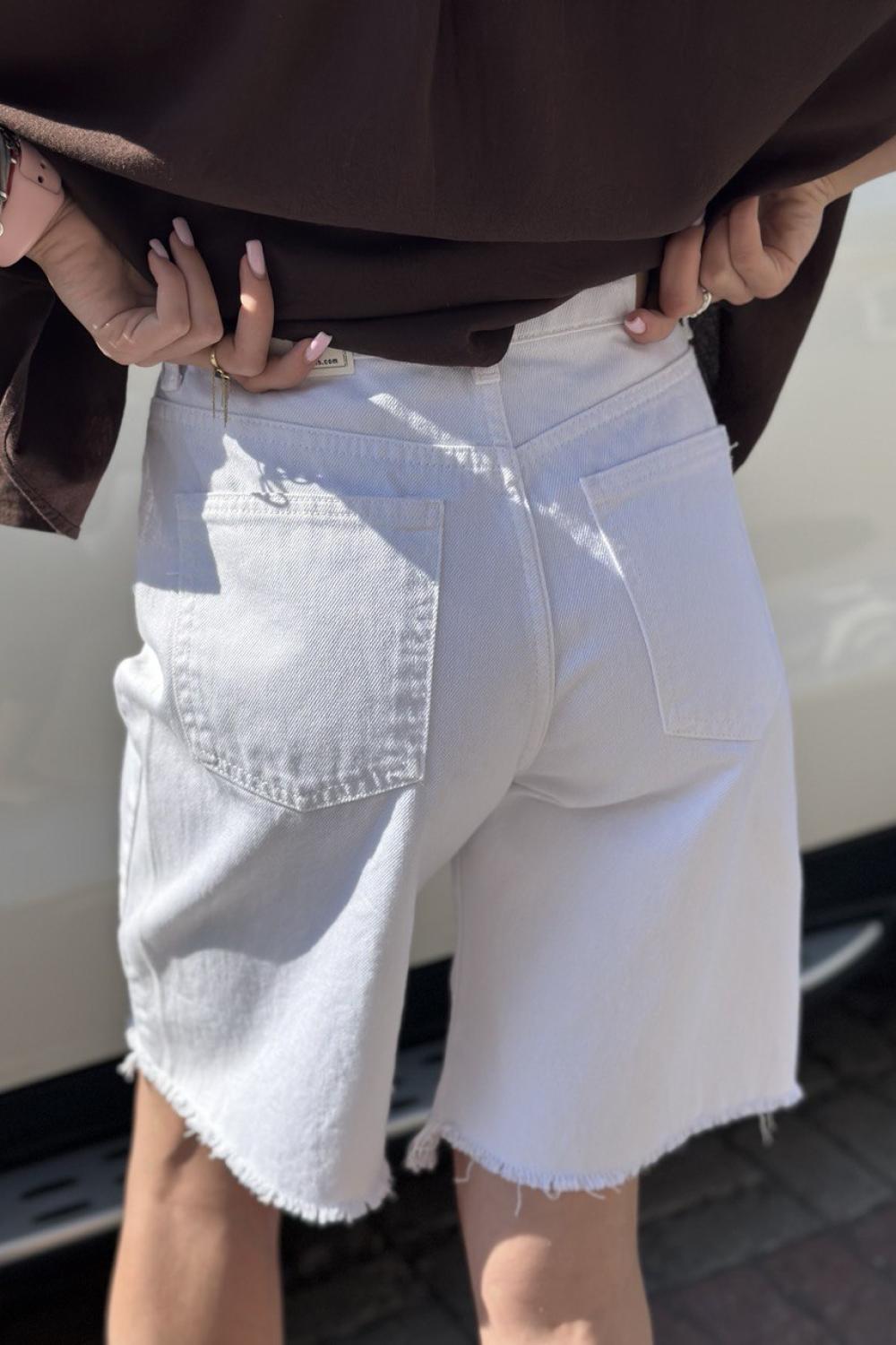 It's basic white elongated denim shorts