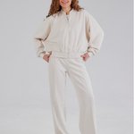 Trouser suit made of high-quality knitwear with an ivory stripe