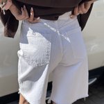 It's basic white elongated denim shorts