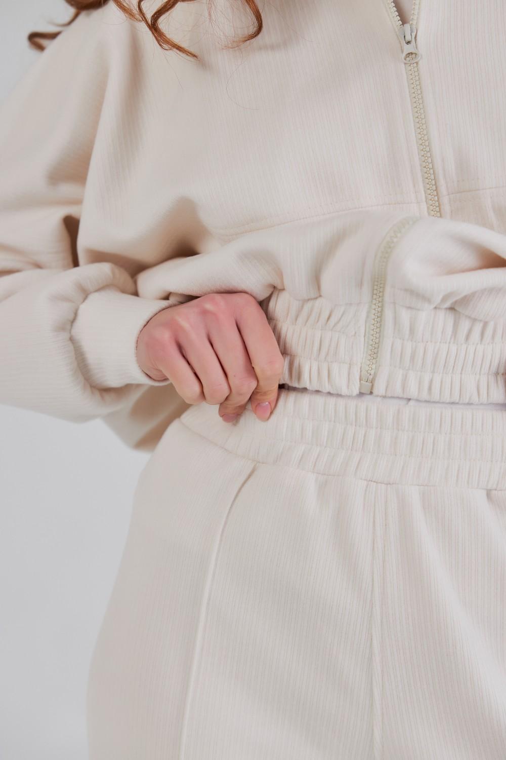 Trouser suit made of high-quality knitwear with an ivory stripe