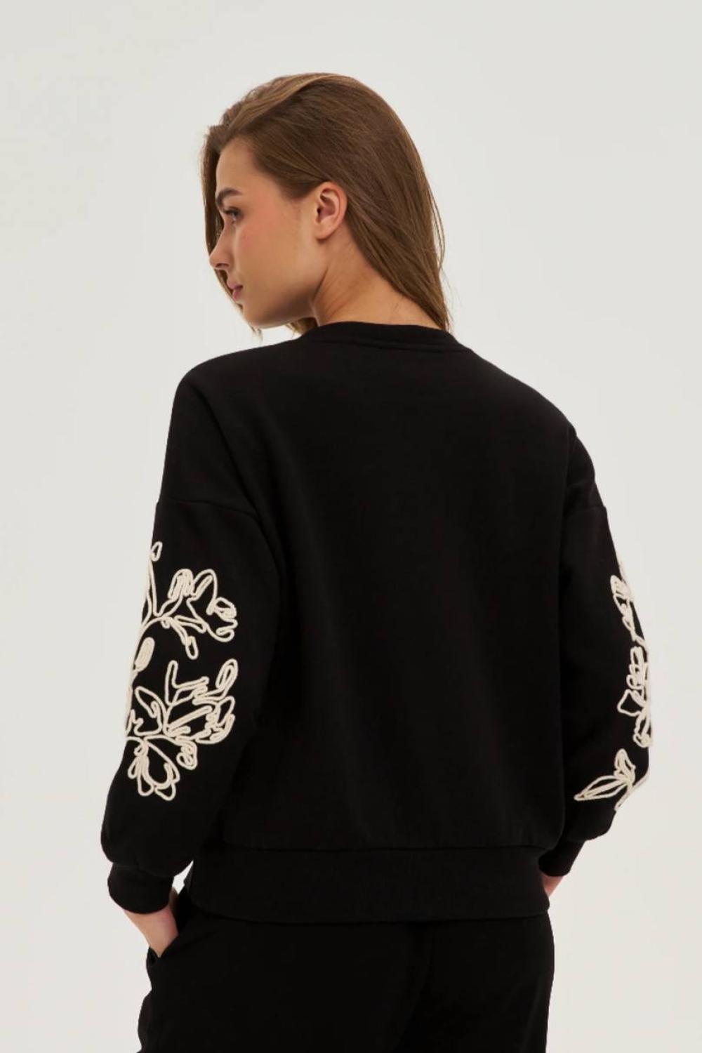 Black sweatshirt with floral appliqué