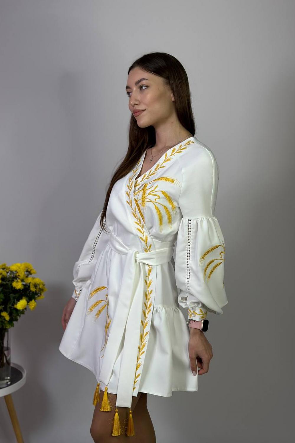 Women's white embroidered dress with gold embroidered spikes