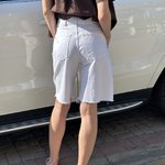 It's basic white elongated denim shorts