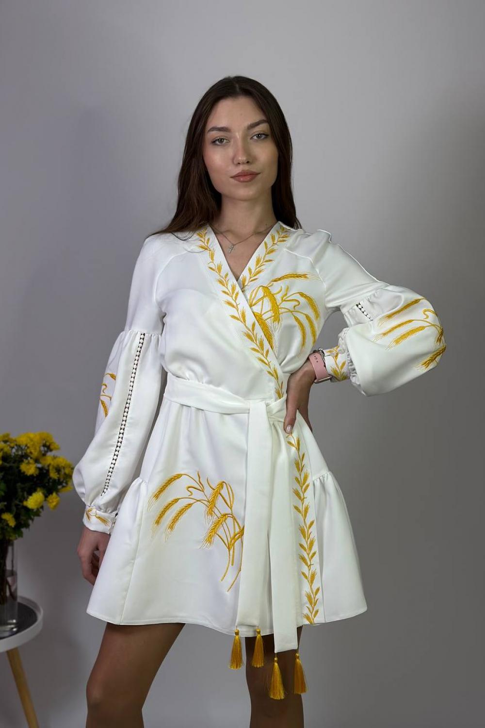 Women's white embroidered dress with gold embroidered spikes