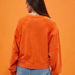 women's sweatshirt is presented in a bright orange color