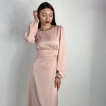 Elegant powder-colored midi-length dress.