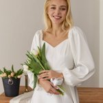White midi length dress for a formal occasion