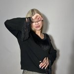 Black knitted sweater with fringe