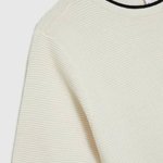 White jumper with piping