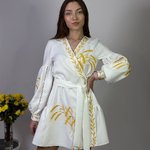 Women's white embroidered dress with gold embroidered spikes
