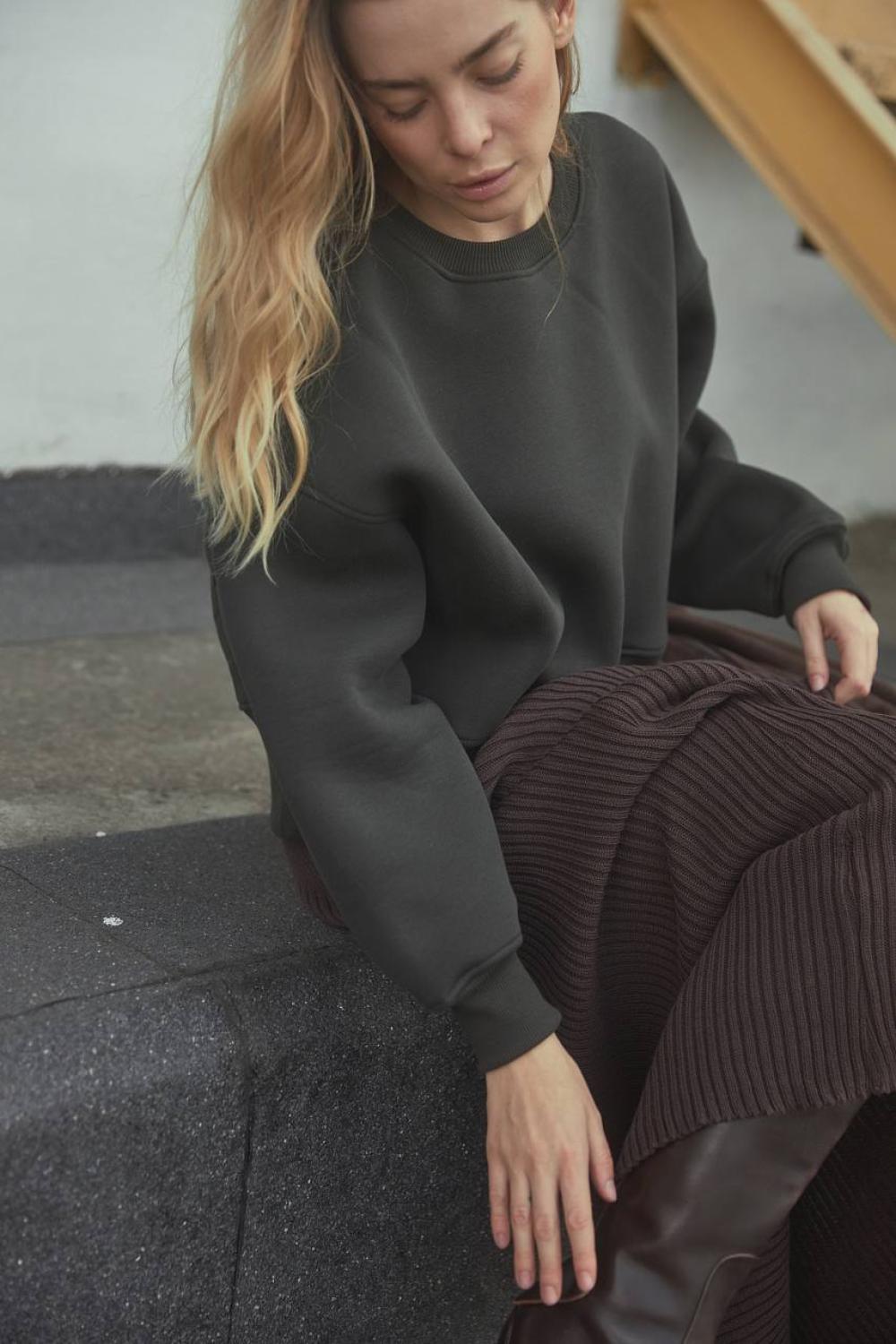 Grey women's sweatshirt on a bike